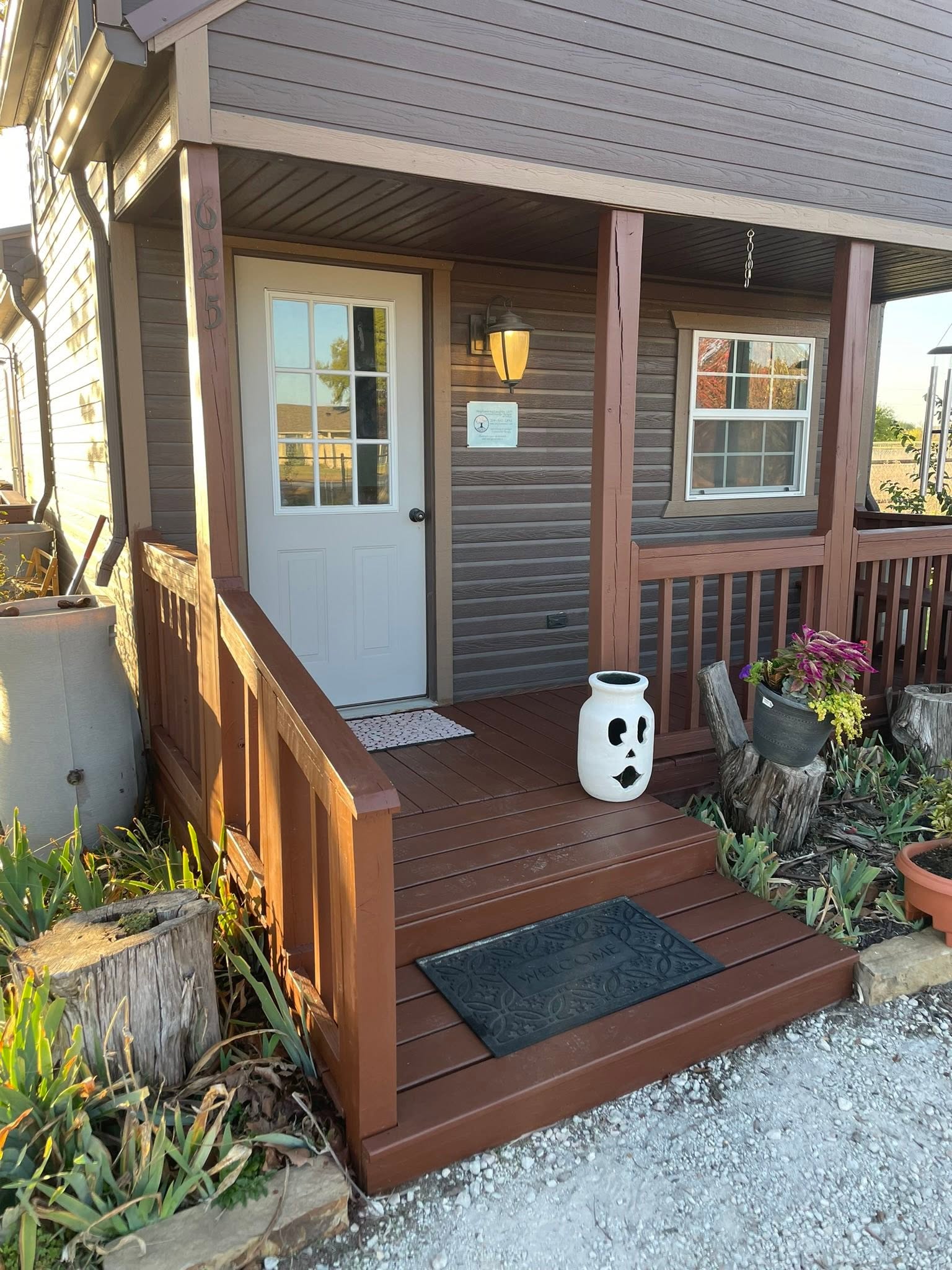 Front porch deck with fresh stain by Andrades GC